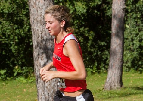 Natalie Harrison runs toward her goals