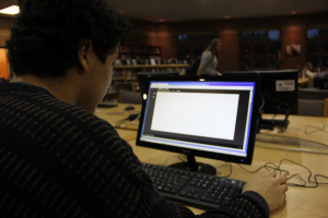 Photo by Annika Kroll Working on Online Geography, junior Pedro Angulo-Umaña makes the library his study space. 