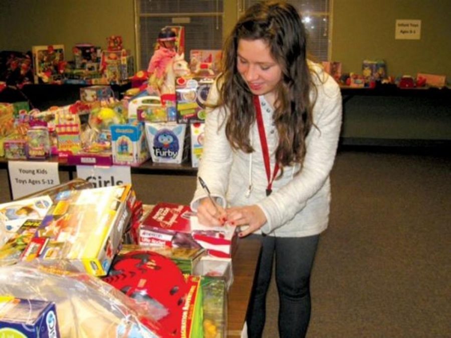 
Senior Paige Hietpas helps with Holiday Hope, a program that helps Stillwater families in need during the Christmas season.
