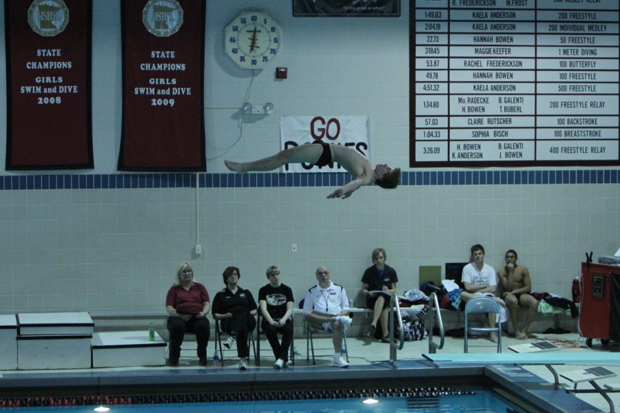 
Showing-off his flawless technique during a reverse straight dive, junior Colin Eason racked up 11 points for his team; 11 points at the particular meet.