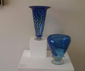 The Capturing Light exhibit at ArtReach St. Croix featured blown glass bowls and pots along with oil paintings. The goal was to use colored glass and oil paintings in order to affect the light in the room.
