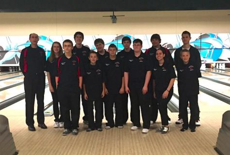 The bowling team gathers near the lanes to show off their advancement to state. Coach Gibson said after they won,  You could see their excitement when they realized they were going to the state tournament.