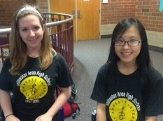 Two members of the Amnesty International Club posted up in the Upper rotunda informing students on the petitions they can sign.
