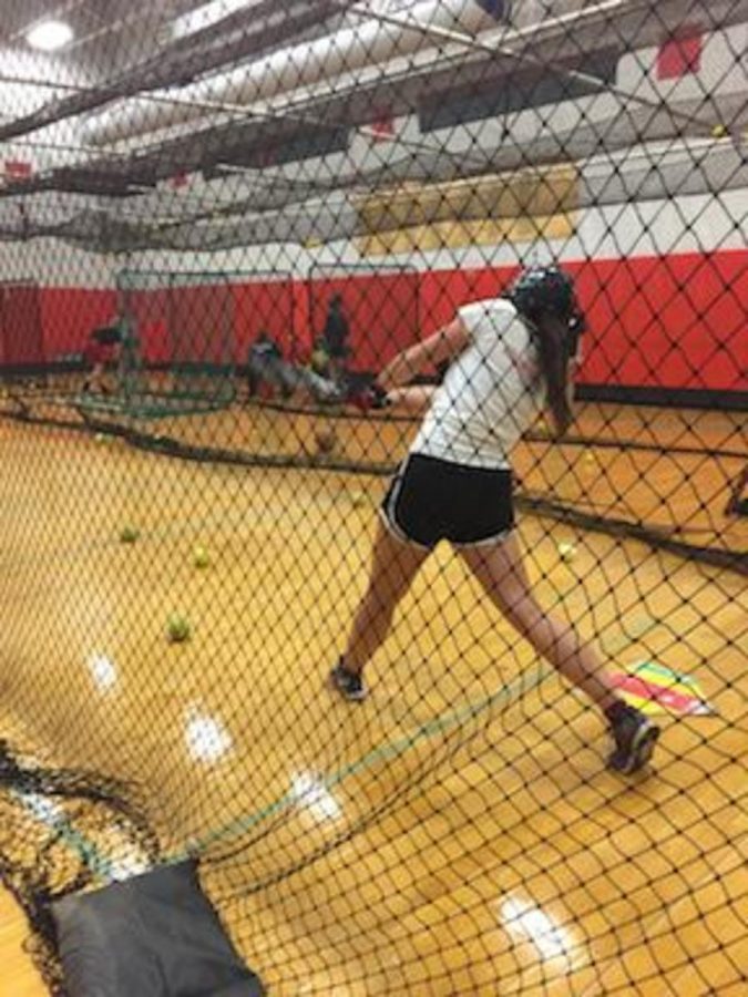 Senior Captain, Rachel Hartwig, is practicing her hitting after the big win against Hill Murray 2-1. My goal is to enjoy my last varsity season and to play my best every game so I dont have any regrets, said Hartwig. 