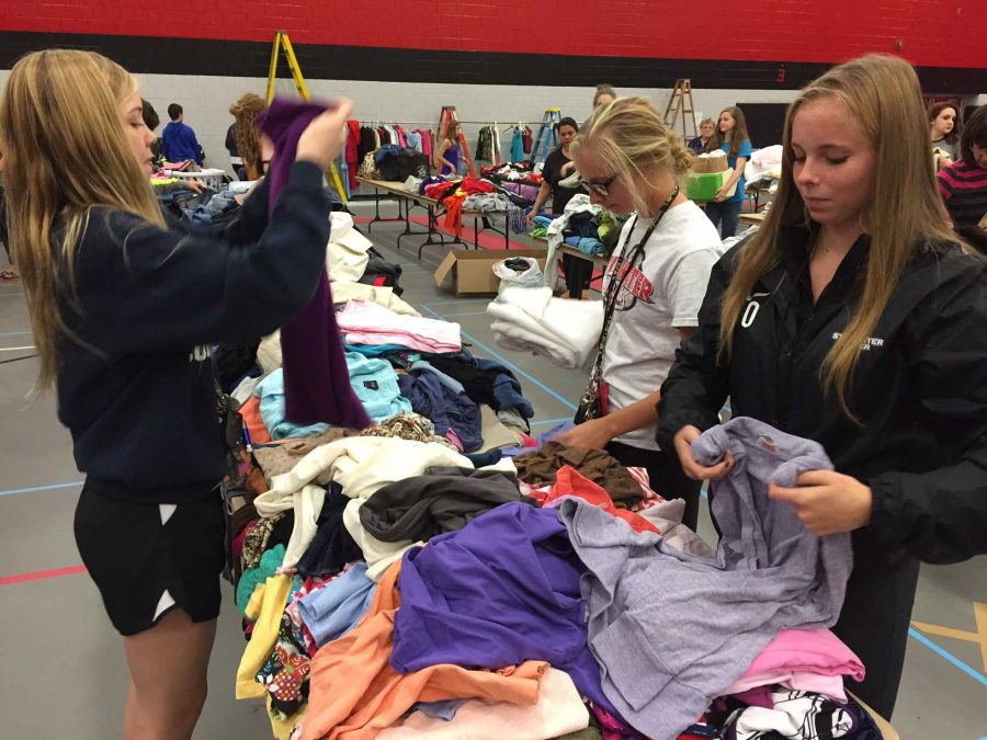 Student volunteers greatly help the sale, they help out with sorting, moving and in this case, folding clothes.  I think we will need more volunteers next year because the sale has been growing each year, said Nelson.  The sale would be much harder without the much needed student volunteers.
