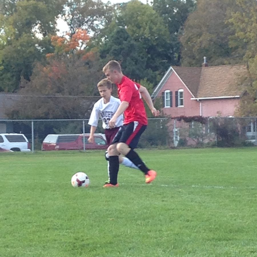 Junior Jack Nelson weaving his way around a Forrest Lake defender in their 6-1 win on October 7th at Forrest Lake.