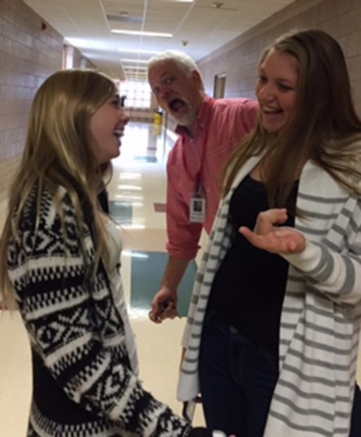 In the English hallway Grace and Mikayla are enjoying a funny conversation with a surprise photo bomb from biology teacher  Corey Quick 
I  always think its funny to give people a surprise visitor in their pictures,