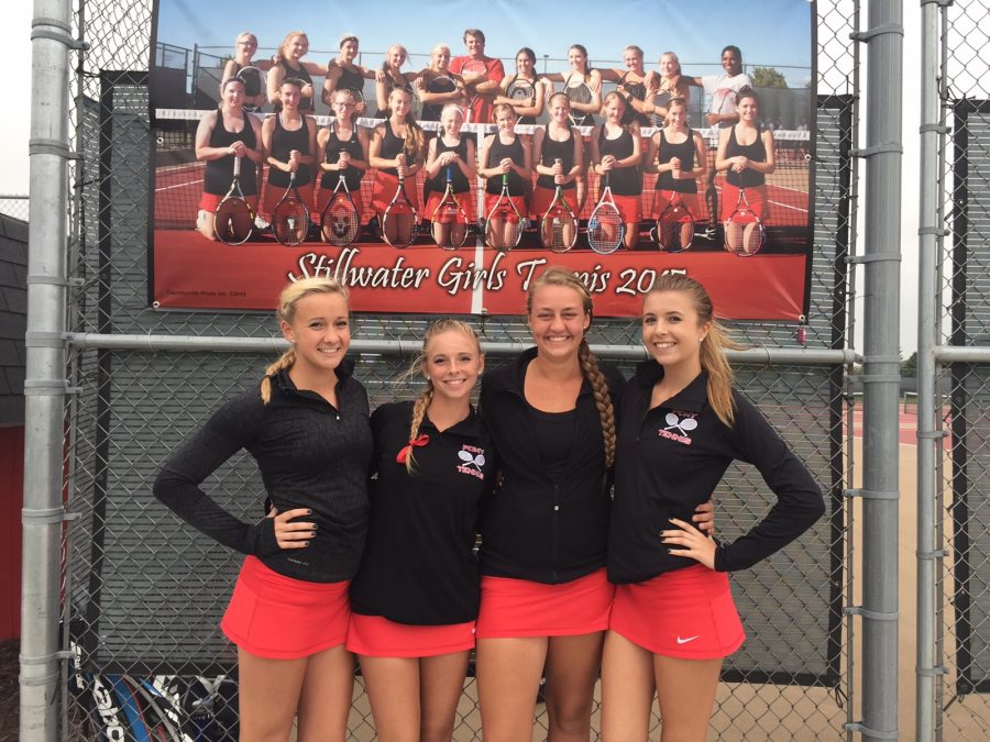 Team captains pose before going to work on the courts to prepare for upcoming opponents. I know we have some tough competition in our bracket, and expect to see some difficult matches ahead, said junior Emma Germundson said. 