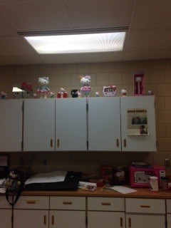 Shelf in the print room with Shannons Hello Kitty stuff on it. 