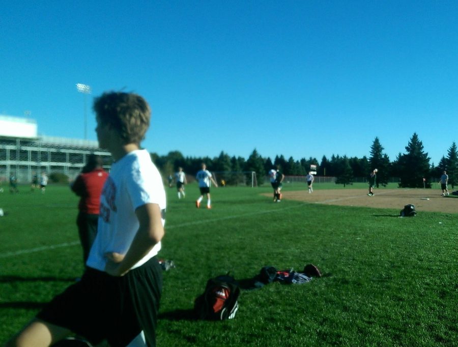 Eric Volkmeier watches as his JV Soccer team takes the lead in their 11th game of the season, all undefeated.