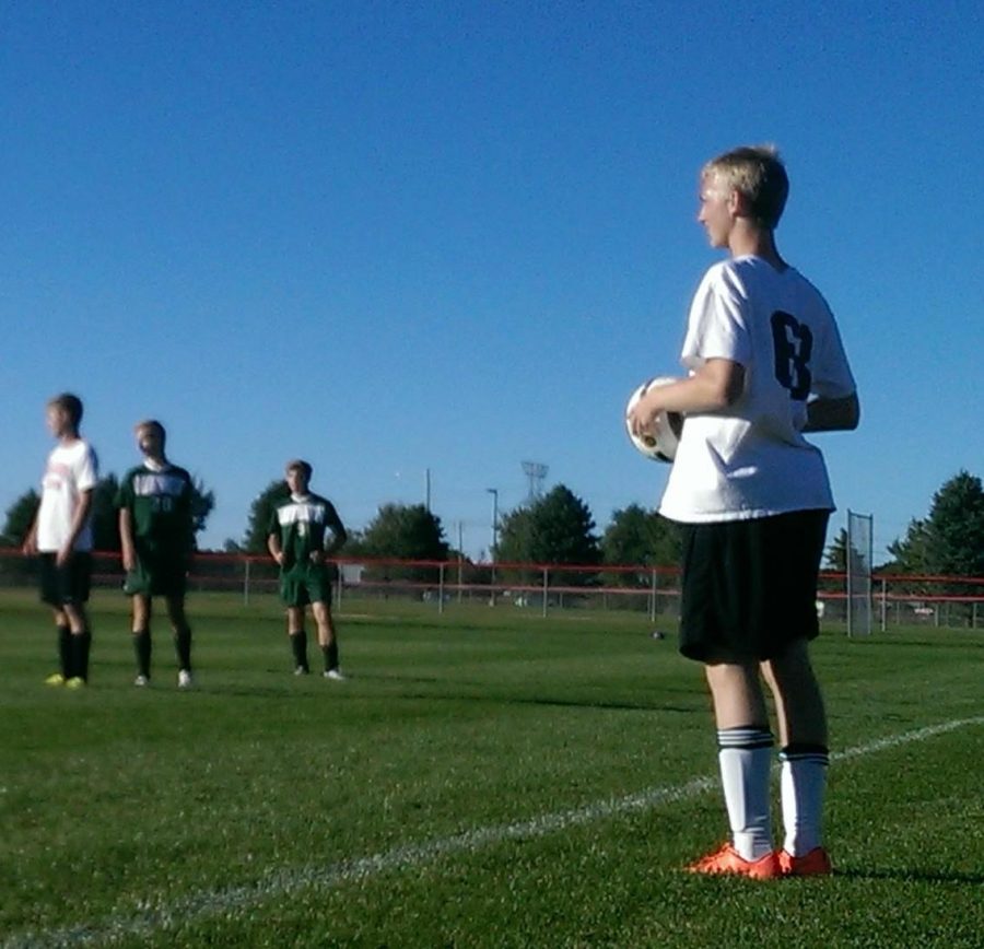Josh Phelps contemplates where to throw the ball during his JV Soccer game last Tuesday