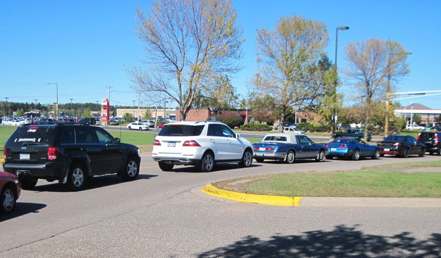 The parking lot after school is always jam packed with kids.