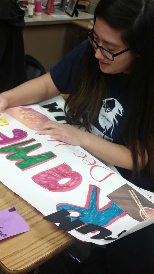 Junior Myndee Lee is a member of kpop club and she is making a poster all about the ramen making contest.  