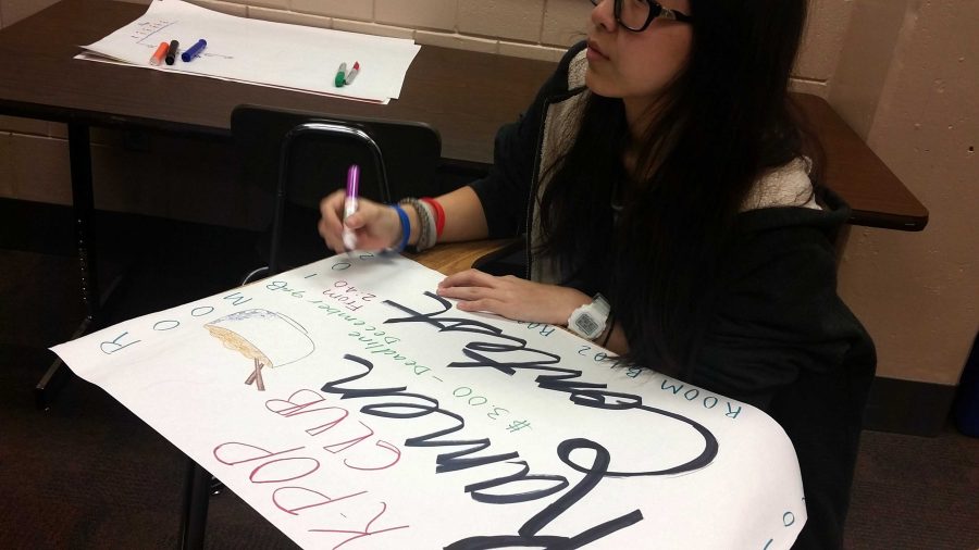 Sophmore Calista Vang is making a poster to promote the ramen making contest. She loves Kpop club and is very excited for the ramen making contest.
