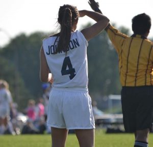 This photo was taken during playoffs while she played for the Mahtomedi team.  Her team won this playoff game, further making it to state. 