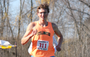 Eli Krahn leading the pack while rounding a corner at state. He has three state titles in track.