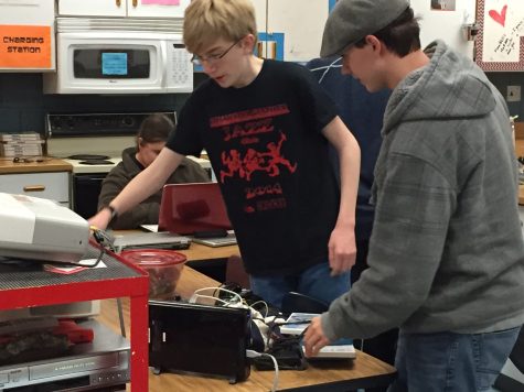 Sophomore Andrew Barton, one of the clubs creators prepares a video game console to be connected to a projector. I was looking through the club list hoping to find something I was interested in. I found nothing into video games or anything geeky, so I thought, Why not make it myself? Barton said.