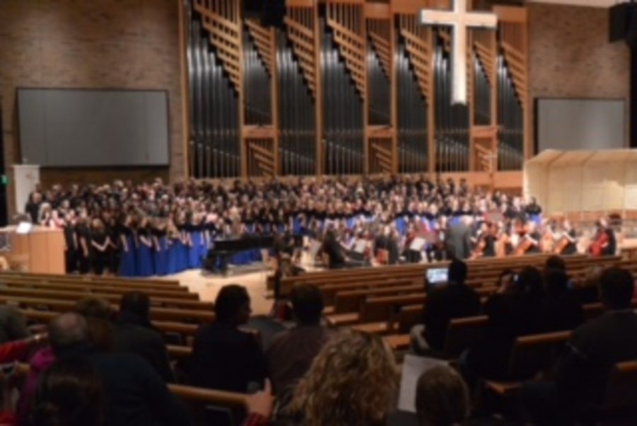 All of the Choirs are lined up all together to perform the mass choir pieces. The organ in the back plays along to all of the voices singing aloud. “The church was jammed packed. There were people standing up because there wasn’t enough seats.”