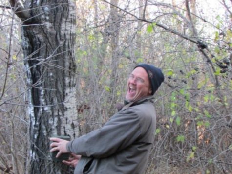 Biology teacher at SAHS for 25 years, Andrew Weaver cracks a joke as he installs trail cameras with his first hour AP Environment Science class. The class is installing 4 cameras in the Environmental Learning Center, a 55 acre multi-biome facility, Weaver says.