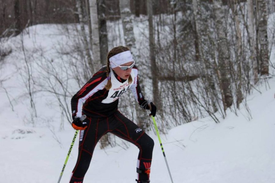 Sophomore Siri Bohachek climbs up a hill at the nordic state tournament last year for the girls teams third place finish. I love participating on the Nordic team, its a great group of people. Bohachek said.