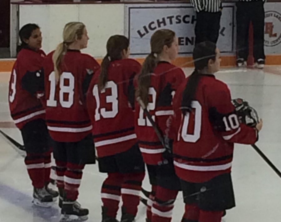 Ana Reding, Olivia Arkell, Lauren Greeder, Olivia Konigson and Abbi Paduano lining up to sing the national anthem on Dec. 10 game against Forest Lake. Senior Olivia Arkell and senior Lauren Greeder are this years hockey captains. “Honestly I just try to be a leader and try to make it fun. I do not like to tell people what to do so I just encourage them in a different way,” Greeder says why she thinks she got chosen to be a captain this year.
