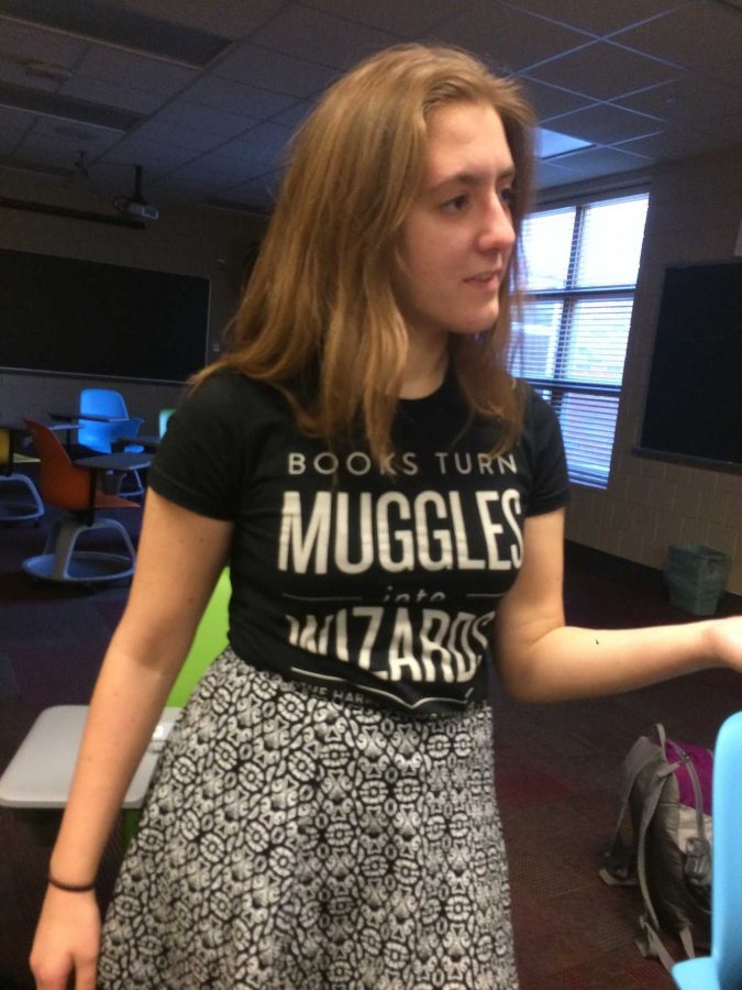 Junior Jenna Slayton displays her Harry Potter pride while speaking to the Hippogrifs. Her shirt references the Accio Books campaign. This campaign provides books to people who need them around the world, and is done through the Harry Potter alliance. Contributing to Accio books is one of the Hippogriffs first goals for the year ahead.