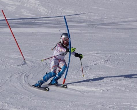 Senior and captain Claire Weber carves down the slopes. She sets the example for the team by performing after hours of hard work in practice. My role on the team is to encourage the skiers to be fearless. to show them a proper technique or give them simple advice on the chairlift about not giving up. I aspire to continue to hold the teams great legacy as it has been held, and to also continue to push everyone to the next level, says Weber. 