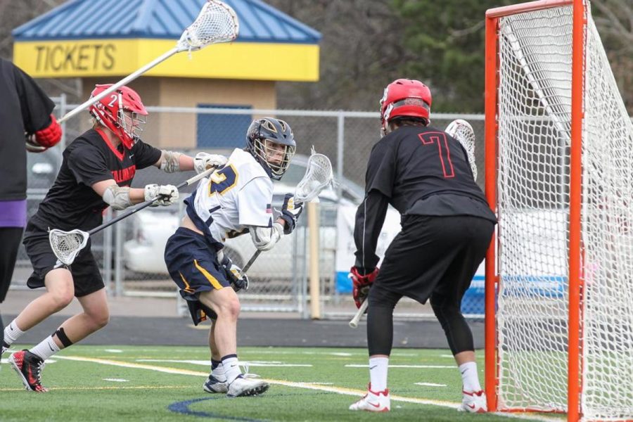 Senior Max Evenson (#2) defending the goal last year against Mahtomedi in the section
 tournament. He looks to be a leader on the team this year and hopes to make a solid run in the post season. Evenson said, We are looking to improve off last year and it will be a lot of fun.