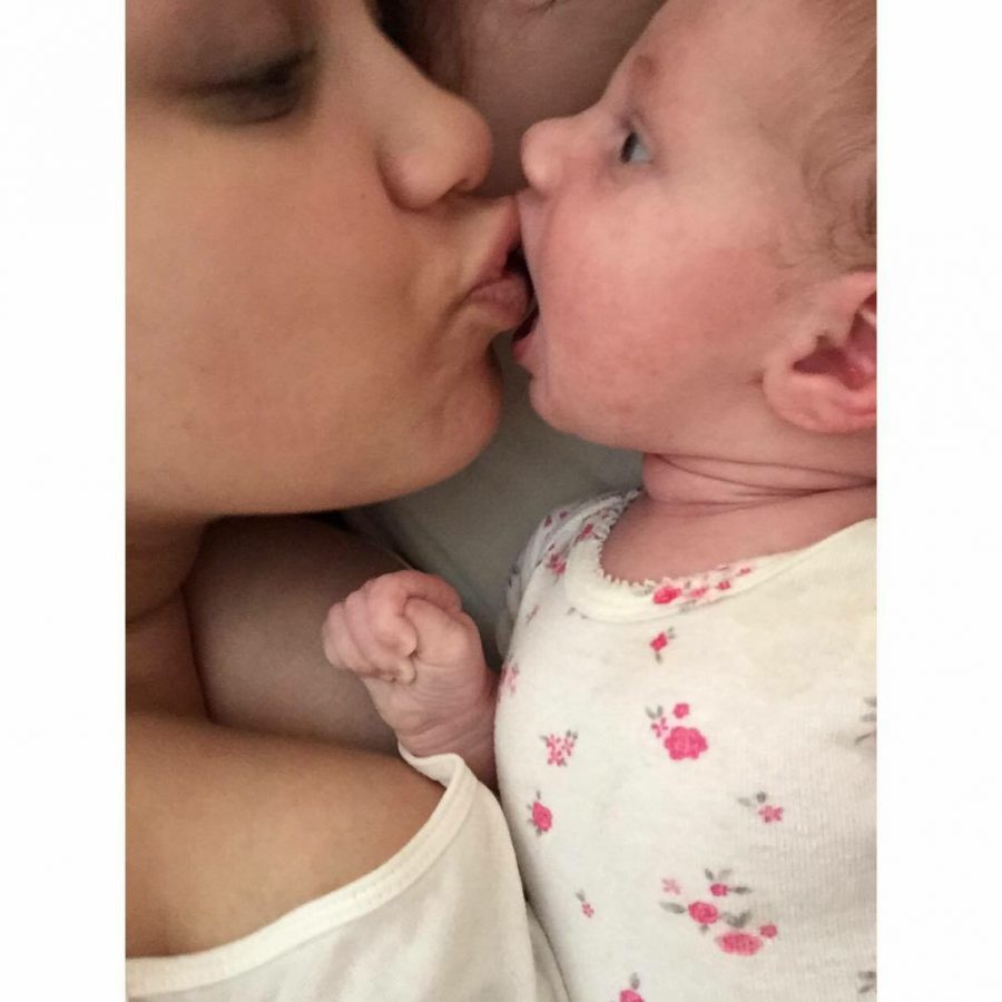 In this picture Toombs bad her daughter Eden are cuddling and Eden is trying to give her mom a kiss. "My daughter was a surprise but a very beautiful one who I love so much," Toombs said.