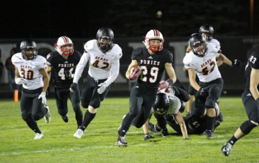 Senior Stephen Wagner running past the White Bear defense on Senior night at Ponies stadium. “I always had it at the back of my mind that every team we played would be the last time Id ever play that team,” says senior Stephen Wagner.