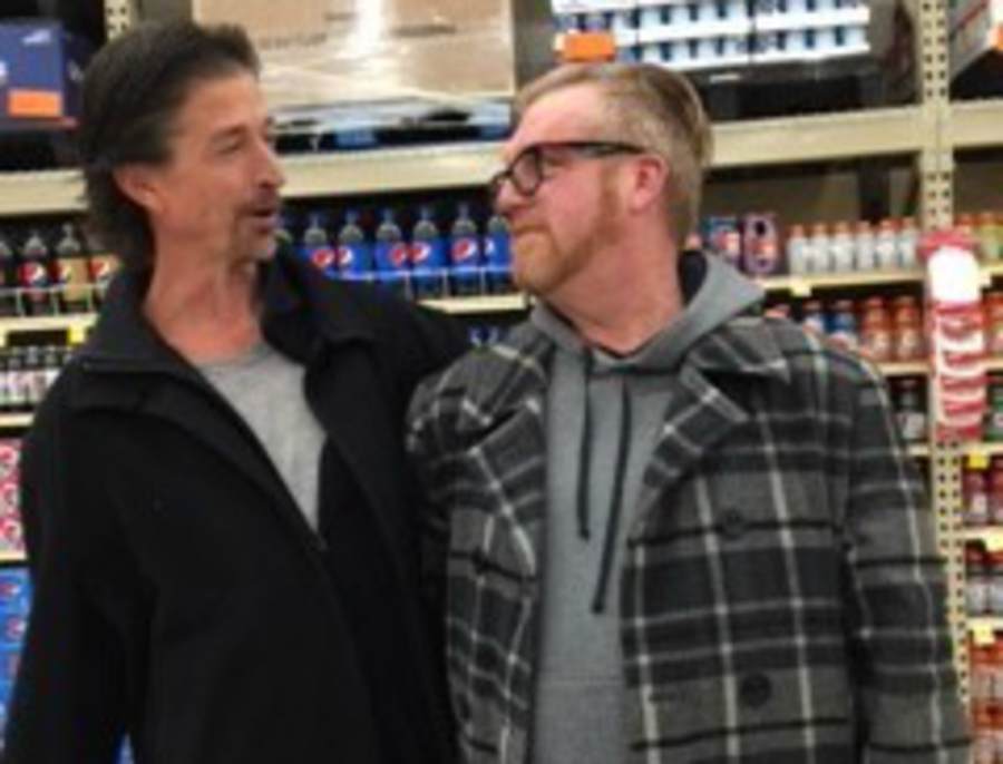 Tom Styrbicki (left) and Mark Johnson (right) pose as brothers after having met each other for the first time in Cub Foods. Johnson said, Hey bro. Whats up bro? This is my brother Tom. Both fall into a fit of laughter after Johnson says This is my brother Tom.