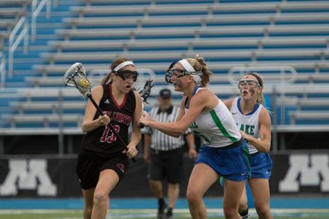 Senior Carly Fedorowski runs down the field against Blake in the 2015 girls lacrosse season. I’m hoping my senior season of lacrosse will help me prepare for whats to come next year. It will be fun to see how different it is at the college level, senior Carly Fedorowski says.