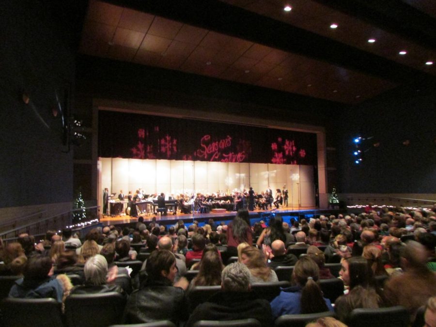 The curtain rises on the Holiday concert, in which Stillwater bands, orchestras, and choirs all performed for a sold out audience in the Stillwater High School Auditorium. Audience members comment that the show was very well done.