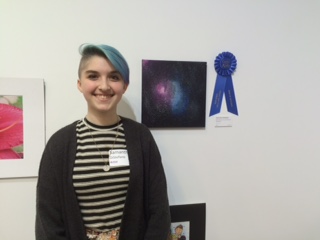 Junior Sam Distefano gleams brightly beside her beautiful piece. Above her name plate is a blue ribbon, a symbol to all of her hard work and talent. “I put a lot of work into this and I cannot even begin to touch on how it feels. I made this thing. People liked this thing. It feels really surreal,” Distefano said.
