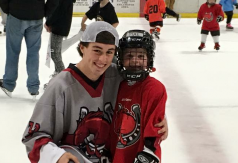 Murr smiles at the camera after coaching what seems to be Stillwaters future hockey players. Purrs great leadership skills help make him a great coach.