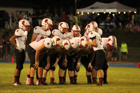 Grayson Hosch calls a play in the huddle. (Courtesy of Ben Anderson)
