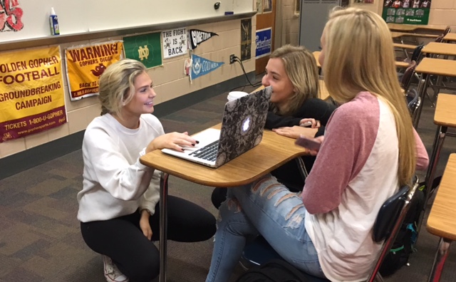 On Oct. 12, a Wednesday morning, sophomores Jolie Anderson, Josie Scherek and Grace Arkell all take a look at Andersons presentation on Donald Trump. 
Everyone in the Youth Republicans is assigned a Republican to make a presentation on and share the facts to the rest of the group. I was assigned to do my presentation on Donald Trump, Anderson said. 