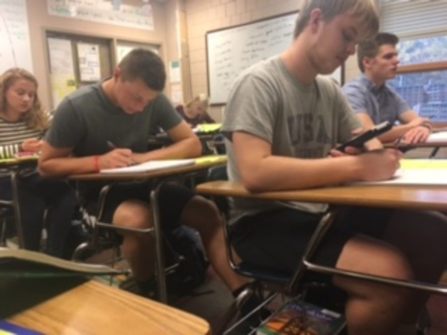 Junior Mason Schwerzler sitting in class comfortably with athletic clothing.
Schwerzler sated, “It helps me grow not only as an athlete, but as a person.”
