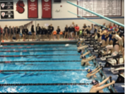 Members of the girls swim and dive team prepare to begin a race. “The beginning of the races are very suspenseful,” says Jackson Wiley, a swim meet atende. “It gets really quiet, then everyone starts screaming once the buzzer goes off.”