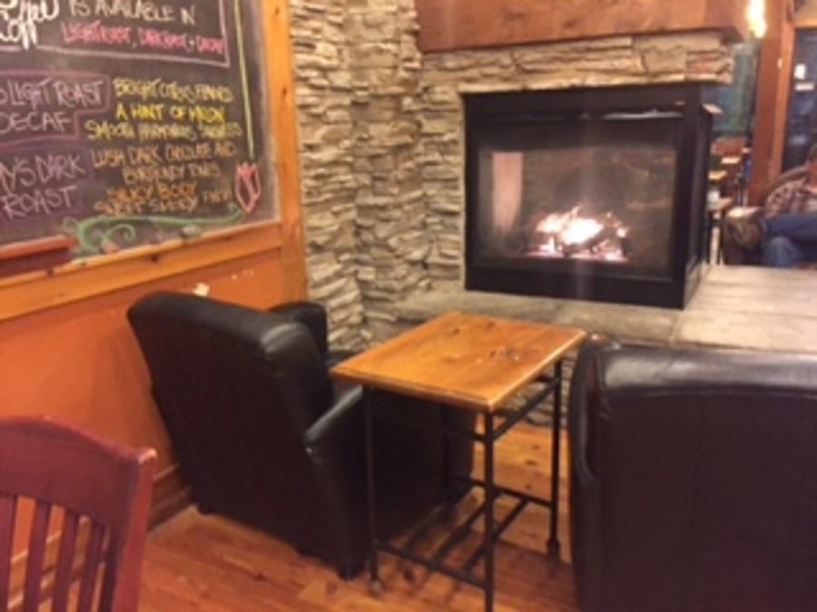 Maddi Hafner enjoying studying by the fireplace inside Caribou.“Caribou has a tranquil fireplace that creates a nice environment for studying and feels less formal than Starbucks” Says Maddi Hafner.