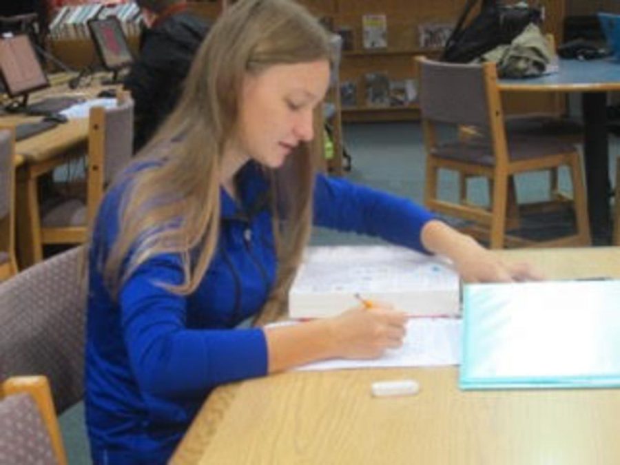 National Merit Scholarship semifinalist Marta Markowitz, studying in the library.