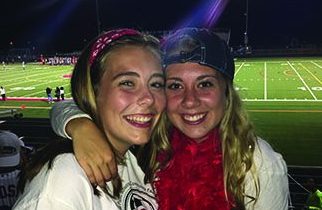 Emily Fiorillo and Michelle Strodthoff enjoying picture time in the Ponies student section! Fiorillo says, Its actually really easy to become friends with people at the games, everyone is united as one giant team.