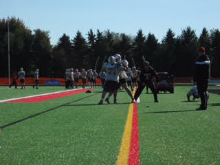 Two Ponies offensive lineman participate in a drill during practice as coach Joe Cousineau watches and encourages on.  Throughout the season our line has battled with injuries, but our team as a whole has cut down on mental errors and the concentration is up, said Junior Luke Simcik.