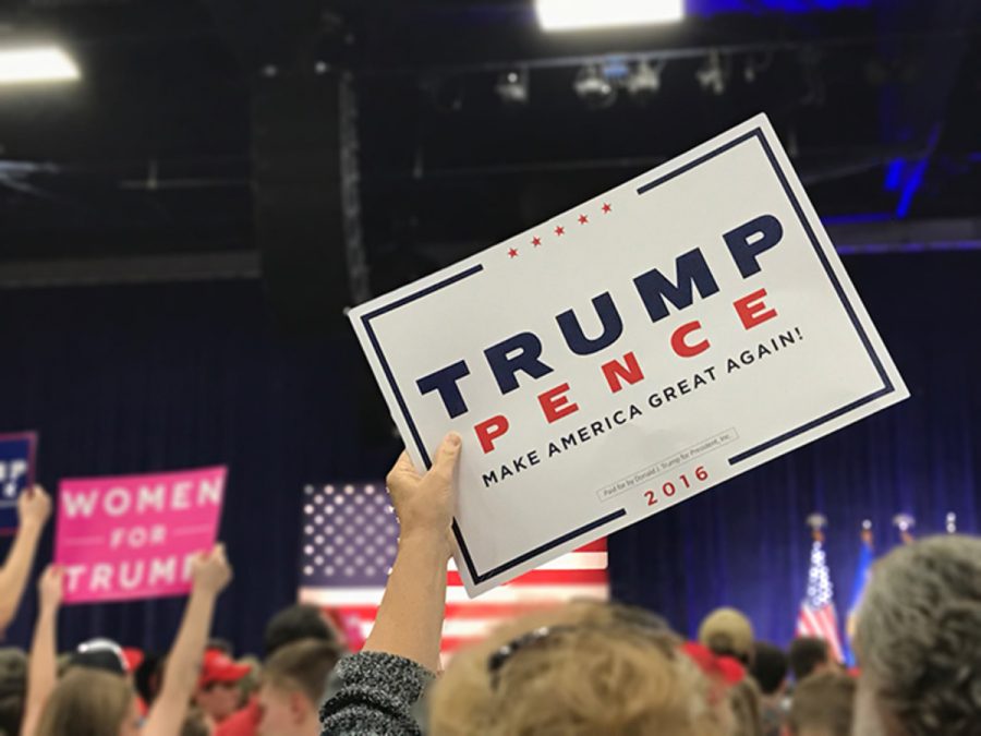 Free paper signs were handed out to the masses, blue and white slogan signs and also Women for Trump signs. Not many in attendance went without a sign in hand.
