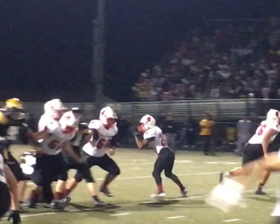 Photo by Gabe Wagner-
Dunleap runs a play action pass out of the backfield in the late parts of the third quarter Friday night. 
It was nice to get involved on the ground and in the air to be able to help the team in different ways Dunleap, says.