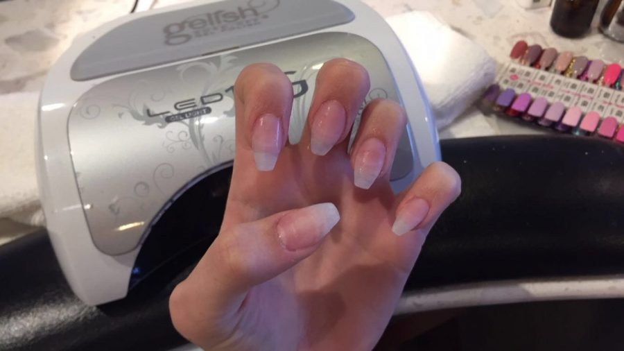 This picture shows what a students nails will look like before the polish goes on. The nails have been cut, filed, sanded down and glued together. The process can get long, almost 45 minutes sometimes. The nails look very nice and healthy in the end though, sophomore Micaela Engebresten says.