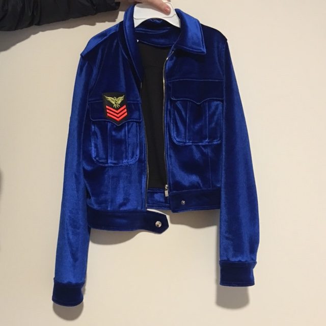 A decorated bomber jacket from the 80s or 90s.  “Quite a few stores have the clothes that are in right now, but the real cheap and actually old trends are in the thrift stores,” tells Sitz.