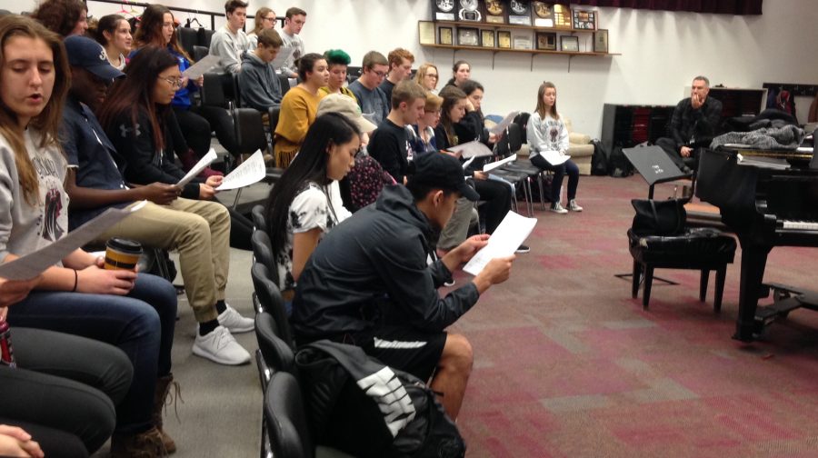 While students rehearse for auditions, Grif Sadow watches the talent of the musicians. 