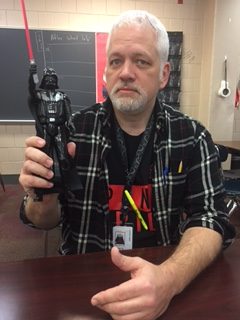 Corey Quick holding a Darth Vader Action Figure