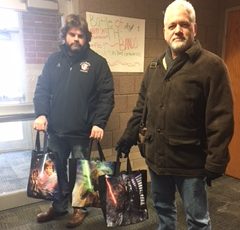 Corey Quick and Paul Wieland holding Star Wars themed bangs.